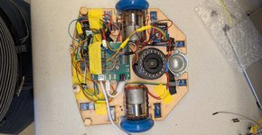 Top-down view of the Sluggers robot chassis: plywood deck, motors, protoboard and wiring